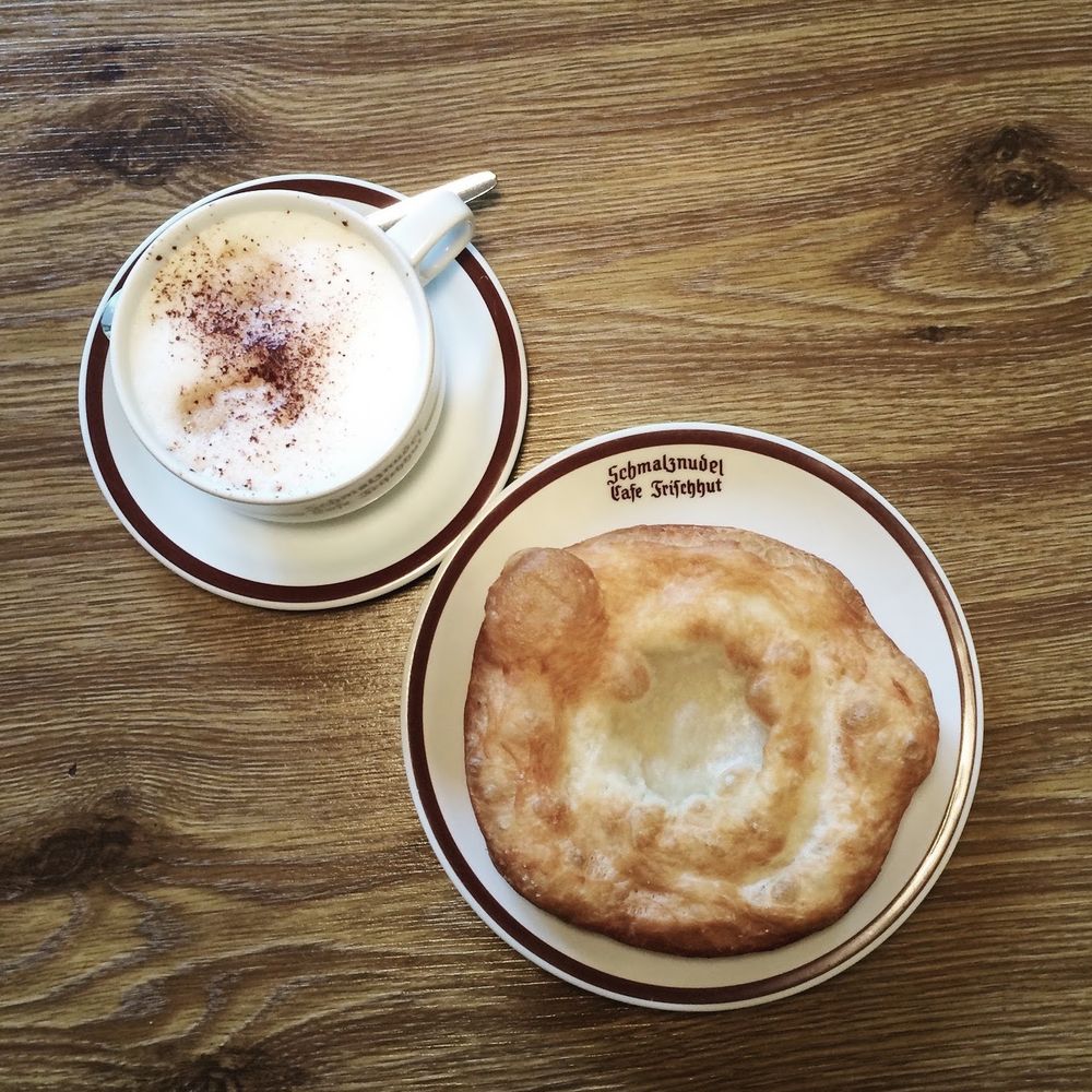 Eating Schmalznudel at Café Frischhut in Munich