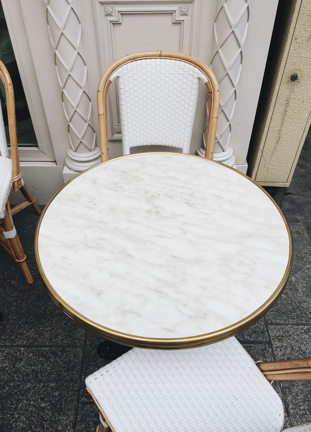 White marble sidewalk cafe table in Paris
