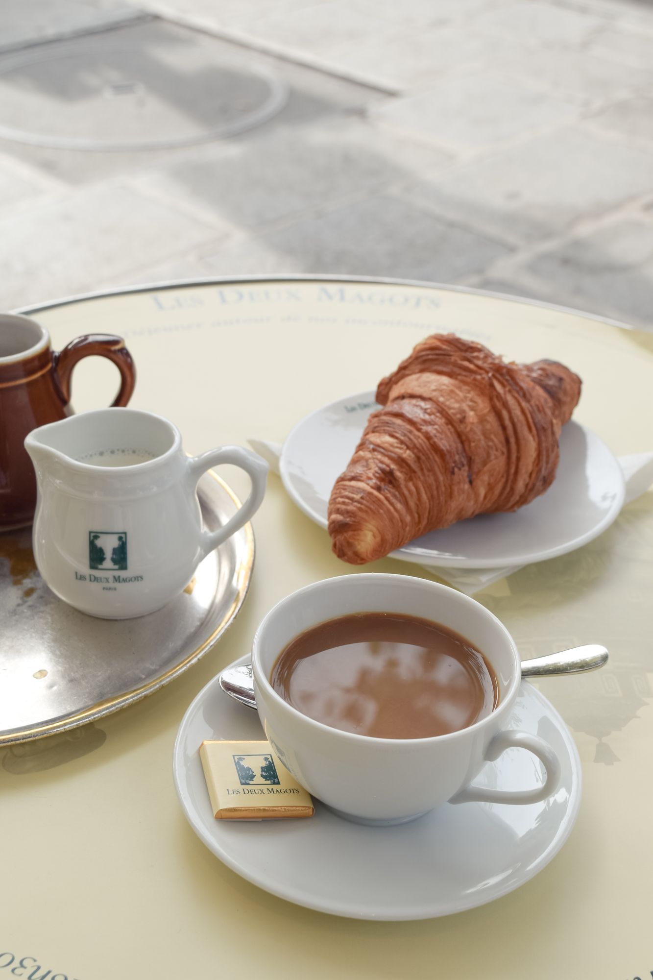 Coffee and croissant at Les Deux Magots, Paris