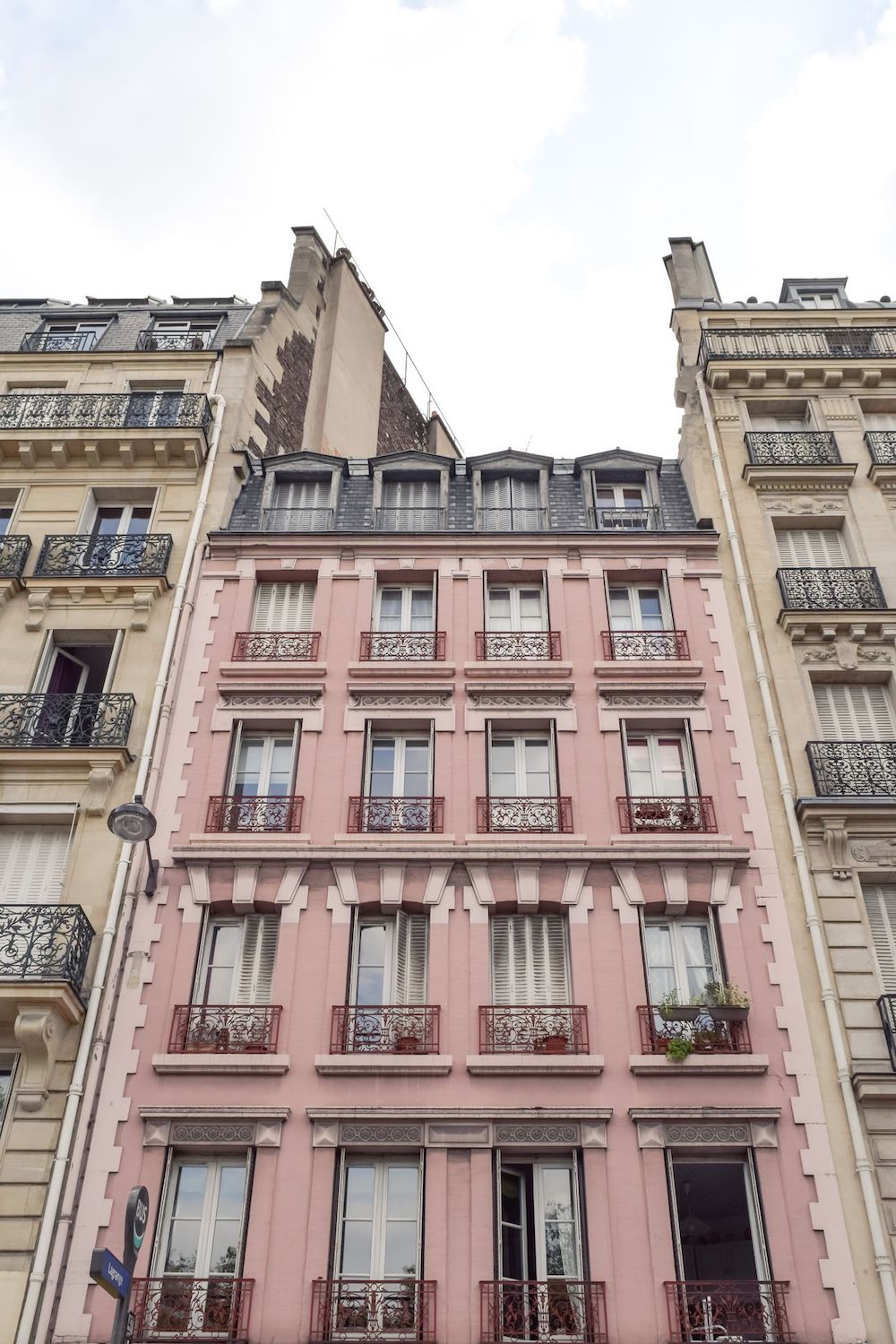 Pink Apartment Building with Pink Balconies in Paris