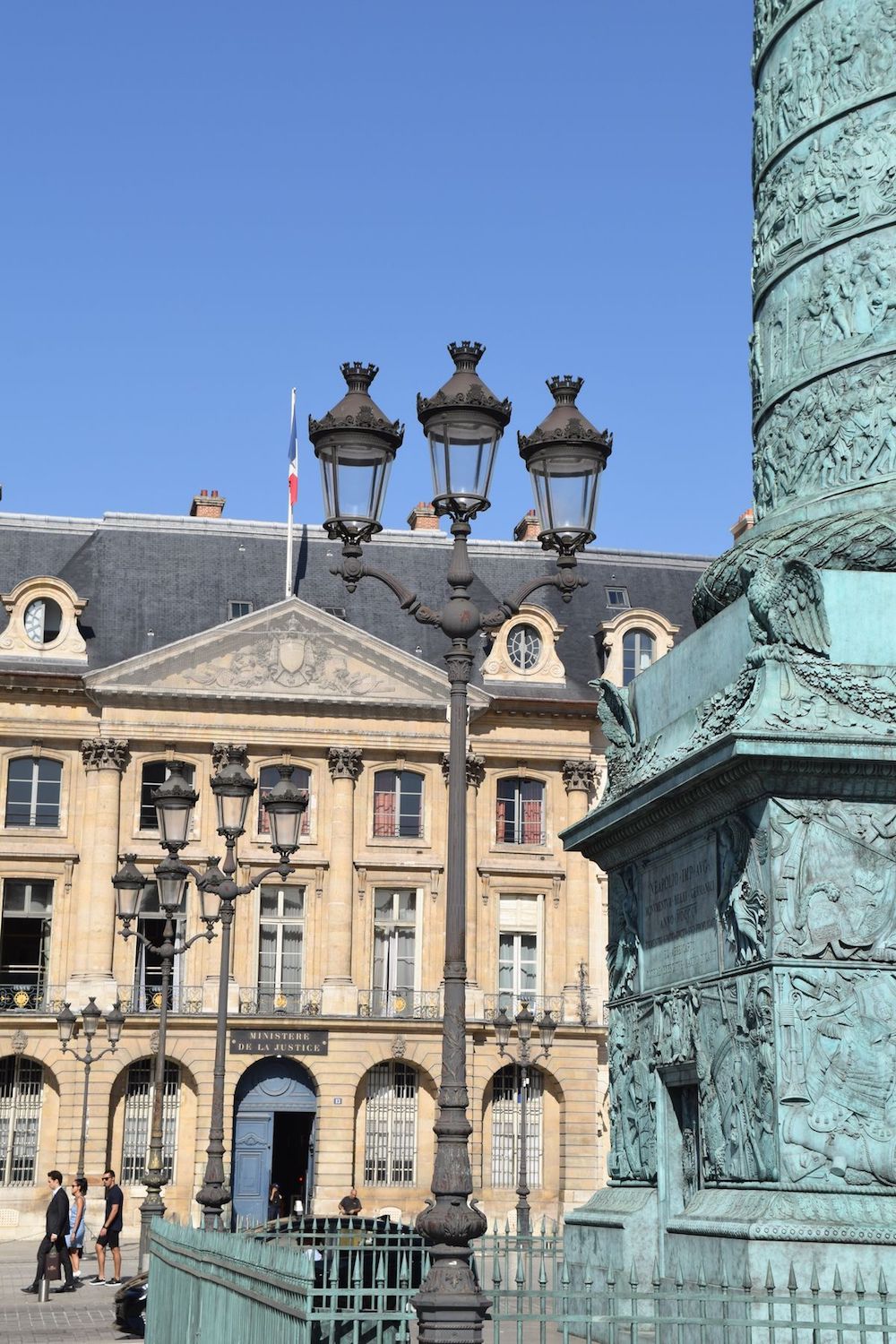 A red bouncy castle in the middle of a beautiful square in Paris