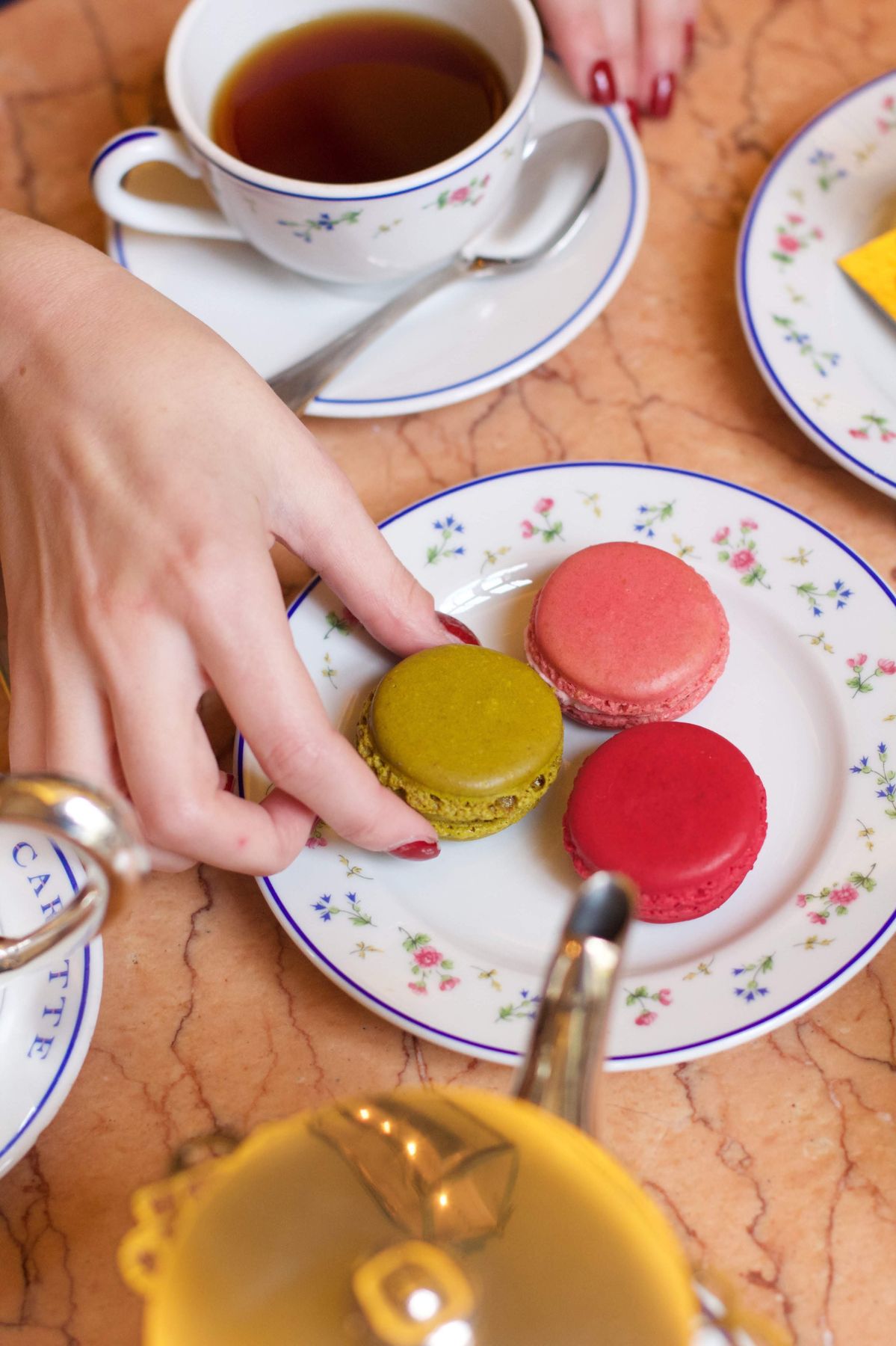 Trying the famous Ladurée macaroons and coffee in Paris