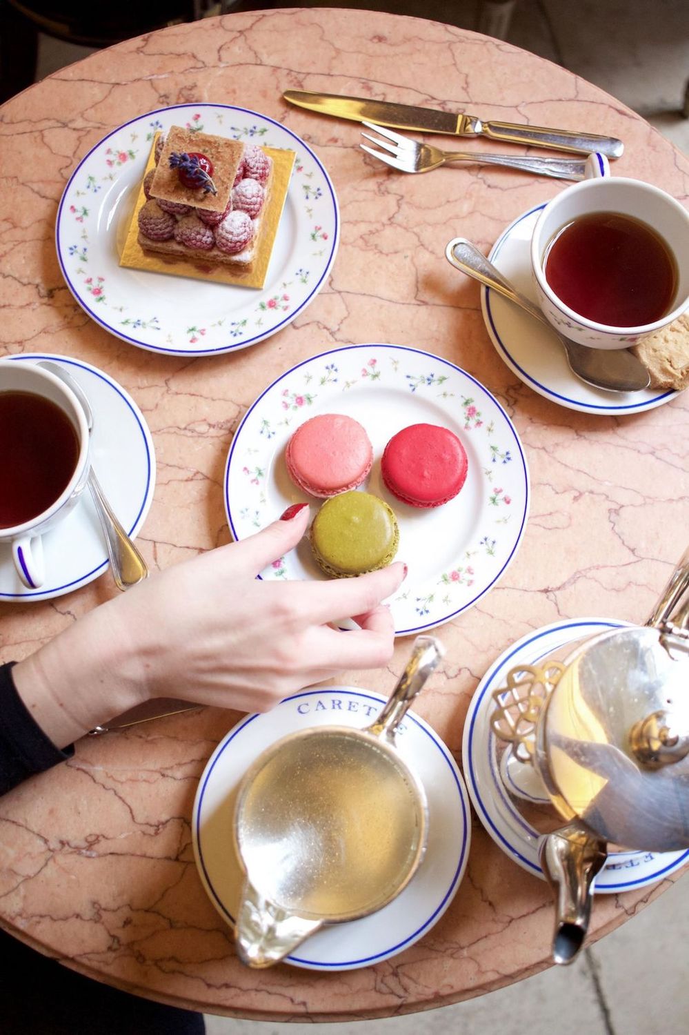 Trying the famous Ladurée macaroons and coffee in Paris