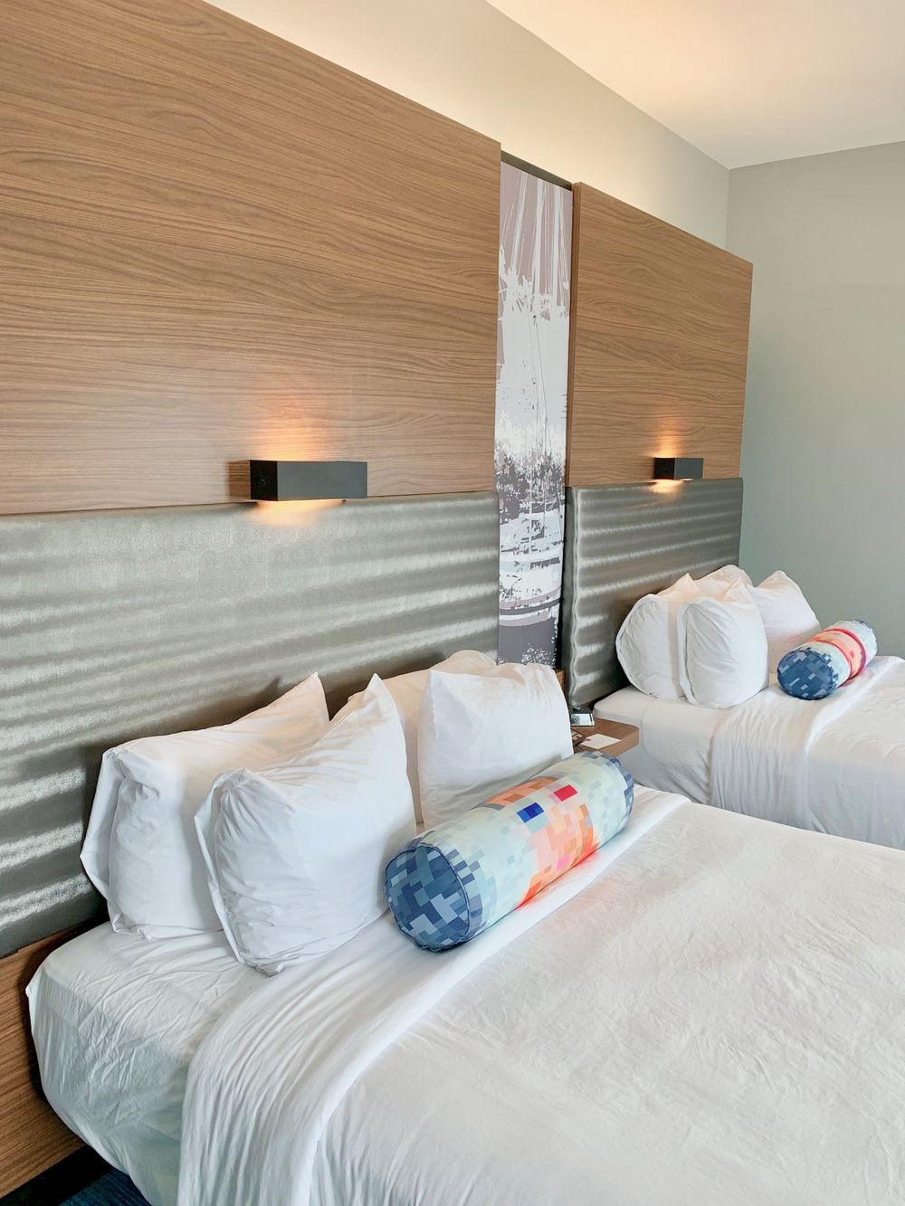 Four pillows on each bed at the Corpus Christi Aloft Hotel