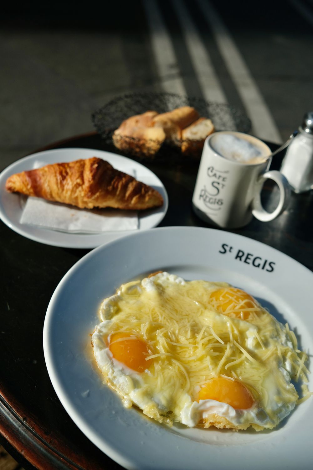 Le Saint Regis breakfast eggs with cheese and croissant